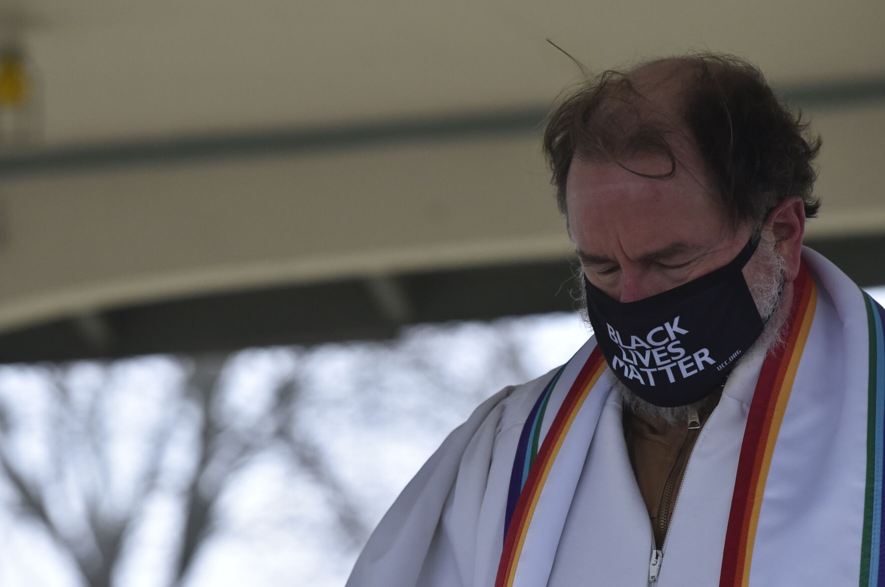 Black Lives Matter mask on a pastor